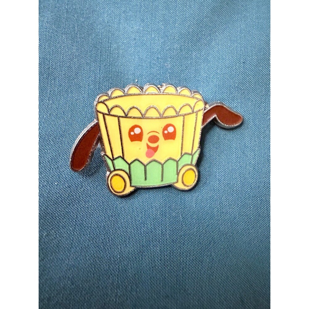 Disneyโs Pluto Peanut Butter Chocolate Swirl Cup enamel pin